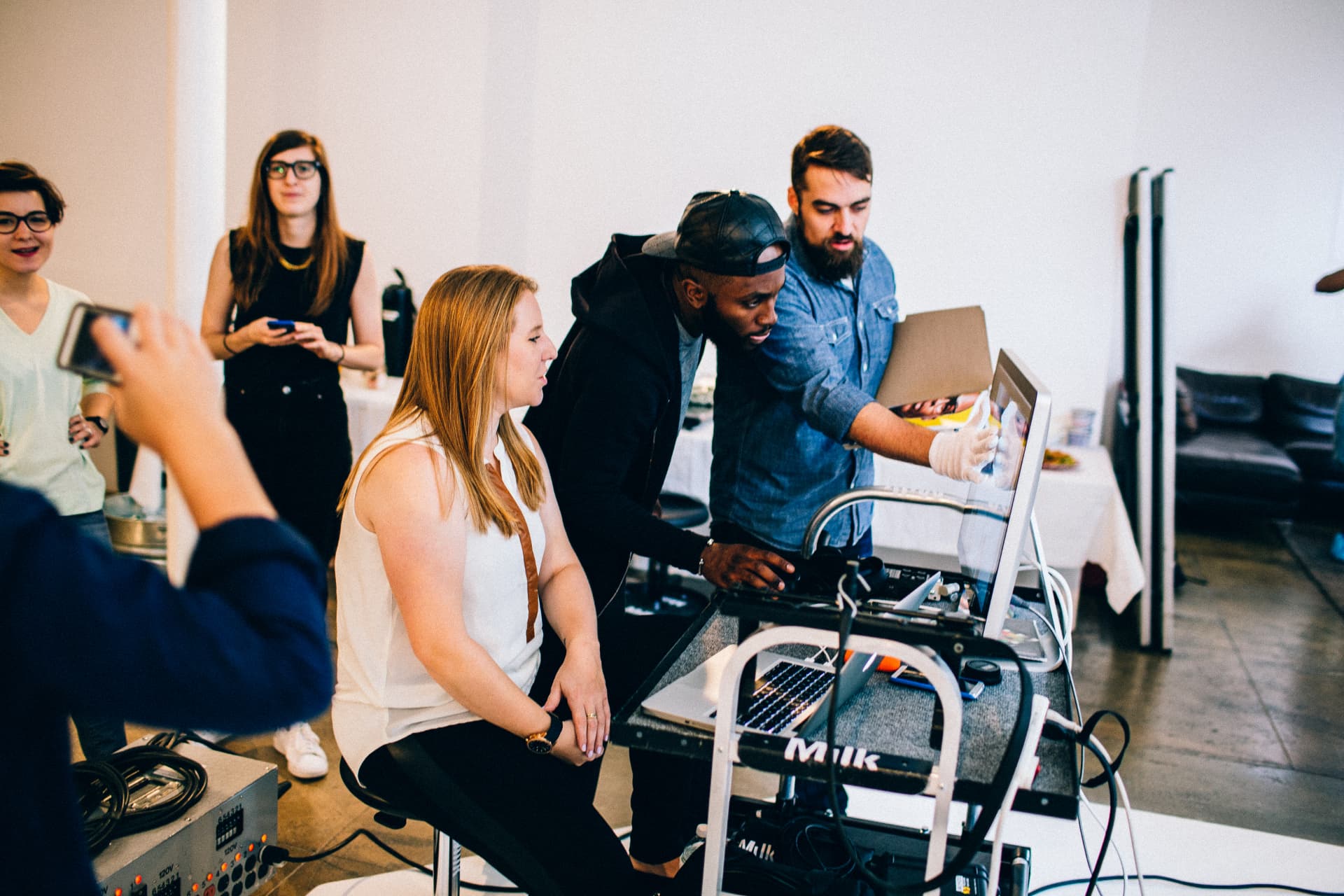 The Will and Wonder team reviewing a shot on set